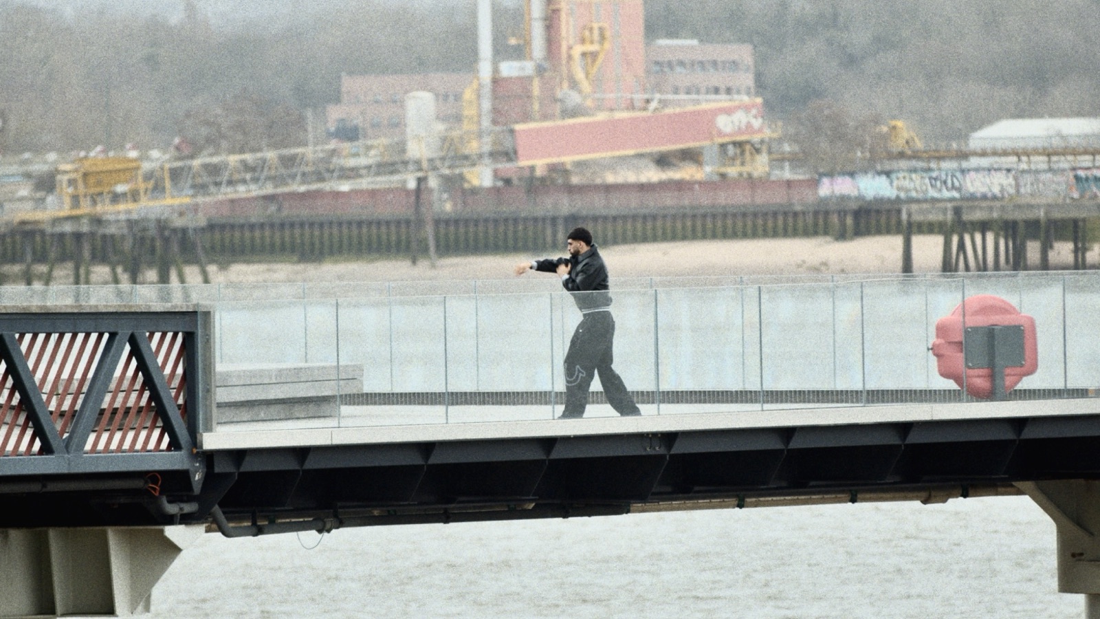 Athlete framed on a city bridge